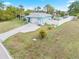 Single-story home with a white fence and a boat at 1638 Viscaya Dr, Port Charlotte, FL 33952