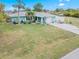 Single-story home with a lush lawn and attached garage at 1638 Viscaya Dr, Port Charlotte, FL 33952