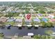 Aerial view showcasing home's location on a canal with neighborhood context at 18305 Wolbrette Cir, Port Charlotte, FL 33948