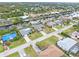 Aerial view of canal-side homes and lush landscape at 18305 Wolbrette Cir, Port Charlotte, FL 33948