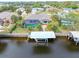 Aerial view of canal-front home with private pool and dock at 18305 Wolbrette Cir, Port Charlotte, FL 33948