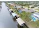 Aerial view highlighting canal-front property with boat lift at 18305 Wolbrette Cir, Port Charlotte, FL 33948