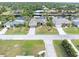 Aerial view of neighborhood with canal-front homes at 18305 Wolbrette Cir, Port Charlotte, FL 33948