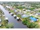 Aerial showing waterfront homes, canal and landscape at 18305 Wolbrette Cir, Port Charlotte, FL 33948