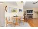 Bright breakfast nook with small table and chairs, adjacent to living room at 18305 Wolbrette Cir, Port Charlotte, FL 33948