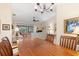 Bright dining room with hardwood floors and a wooden table at 18305 Wolbrette Cir, Port Charlotte, FL 33948