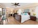 Main bedroom with plush bedding, walk-in closet, and access to the patio at 18305 Wolbrette Cir, Port Charlotte, FL 33948