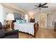 Main bedroom with en-suite bathroom and hardwood floors at 18305 Wolbrette Cir, Port Charlotte, FL 33948