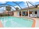 Inviting kidney-shaped pool with screened enclosure at 18305 Wolbrette Cir, Port Charlotte, FL 33948