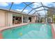 Enjoy the refreshing pool and spacious screened lanai at 18305 Wolbrette Cir, Port Charlotte, FL 33948