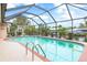 Inviting screened pool with ample deck space for relaxation and entertainment at 18305 Wolbrette Cir, Port Charlotte, FL 33948