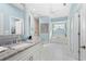 Elegant bathroom with a double vanity, soaking tub, and shower at 1966 Trout Cir, Englewood, FL 34224