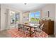 Bright dining room featuring a wooden table and access to a patio at 1966 Trout Cir, Englewood, FL 34224