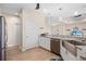 Modern kitchen with white cabinetry, stainless steel appliances, and a large sink at 1966 Trout Cir, Englewood, FL 34224