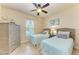 Bedroom with twin beds, dresser, and window at 2064 El Cerito Ct, Punta Gorda, FL 33950