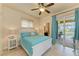 Bright bedroom with white shutters, tile floors and access to the pool at 2064 El Cerito Ct, Punta Gorda, FL 33950