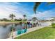 Private boat dock with two teal chairs and canal views at 2064 El Cerito Ct, Punta Gorda, FL 33950