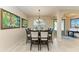 Formal dining room with a large square table and chandelier at 2064 El Cerito Ct, Punta Gorda, FL 33950