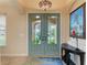 Bright and airy entryway with double doors and unique light fixture at 2064 El Cerito Ct, Punta Gorda, FL 33950