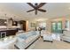 Living area showcasing a white leather couch and kitchen island view at 2064 El Cerito Ct, Punta Gorda, FL 33950