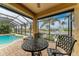 Relaxing poolside seating area with water views and screened enclosure at 2064 El Cerito Ct, Punta Gorda, FL 33950