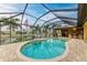 Enclosed pool and patio area with canal view and lounge chairs at 2064 El Cerito Ct, Punta Gorda, FL 33950