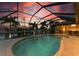 Relaxing pool and patio area with a screened enclosure and water views at 2064 El Cerito Ct, Punta Gorda, FL 33950