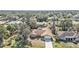 Aerial view of charming single-story home with well-maintained landscaping in residential neighborhood at 21217 Knollwood Ave, Port Charlotte, FL 33952