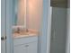 Vanity with marble countertop and walk-in shower at 21217 Knollwood Ave, Port Charlotte, FL 33952