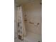 Clean bathroom with a shower/tub combo, grab bar and neutral tile at 21217 Knollwood Ave, Port Charlotte, FL 33952