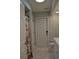 Bathroom features a shower, patterned floor, and access to other rooms at 21217 Knollwood Ave, Port Charlotte, FL 33952