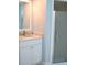 Bathroom featuring a modern vanity with granite countertop and a glass-enclosed shower at 21217 Knollwood Ave, Port Charlotte, FL 33952