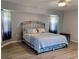 Spacious main bedroom with a king-size bed and bay window at 21217 Knollwood Ave, Port Charlotte, FL 33952