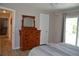 Bedroom with built-in dresser and sliding door to backyard at 21217 Knollwood Ave, Port Charlotte, FL 33952