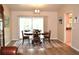 Bright dining room with sliding glass doors to the outside, chandelier lighting, and space for a table at 21217 Knollwood Ave, Port Charlotte, FL 33952