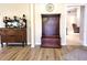 Entryway with coat rack, hardwood flooring and neutral color scheme at 21217 Knollwood Ave, Port Charlotte, FL 33952