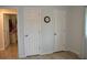 Home hallway with two large closets and neutral color palette at 21217 Knollwood Ave, Port Charlotte, FL 33952