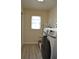 Laundry room with washer, dryer, and cabinets at 21217 Knollwood Ave, Port Charlotte, FL 33952