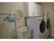 Laundry room with washer, dryer, sink, and cabinets at 21217 Knollwood Ave, Port Charlotte, FL 33952