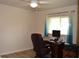 Home office with a desk, chair and plenty of natural light at 21217 Knollwood Ave, Port Charlotte, FL 33952