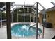 Relaxing kidney-shaped pool with screened enclosure at 21217 Knollwood Ave, Port Charlotte, FL 33952