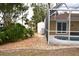 Side view of the screened pool and adjacent yard at 21217 Knollwood Ave, Port Charlotte, FL 33952