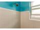 Simple bathroom with a shower and tiled walls at 21354 Austin Ave, Port Charlotte, FL 33952