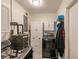 Functional laundry room with a washer, dryer, and storage at 21354 Austin Ave, Port Charlotte, FL 33952