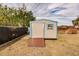 Tan and blue storage shed with wooden ramp at 21354 Austin Ave, Port Charlotte, FL 33952