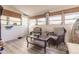 Relaxing sunroom with wicker chairs and a comfy sofa at 21354 Austin Ave, Port Charlotte, FL 33952