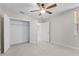 Spacious bedroom with ceiling fan and ample closet space at 240 W End Dr # 212, Punta Gorda, FL 33950