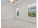 Well-lit bedroom with two windows and neutral carpeting at 240 W End Dr # 212, Punta Gorda, FL 33950