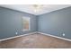 Simple bedroom with neutral walls and carpeted floor at 2411 Altoona Ave, North Port, FL 34286