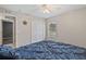 Well-lit bedroom with a blue comforter and window at 2411 Altoona Ave, North Port, FL 34286